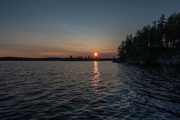 The sun sets as I paddle near the place where Rod landed his monster pike in 2011.
