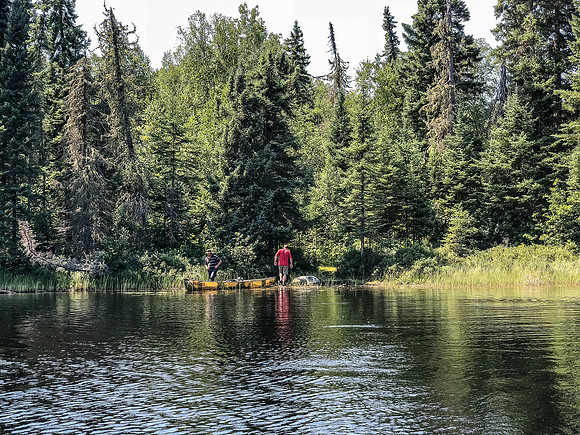 Finishing up a portage on Hjalmar Lakes.