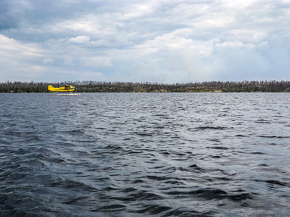 Disembarked and watching the Beaver take off to pick up and return with Harold and Hentie.