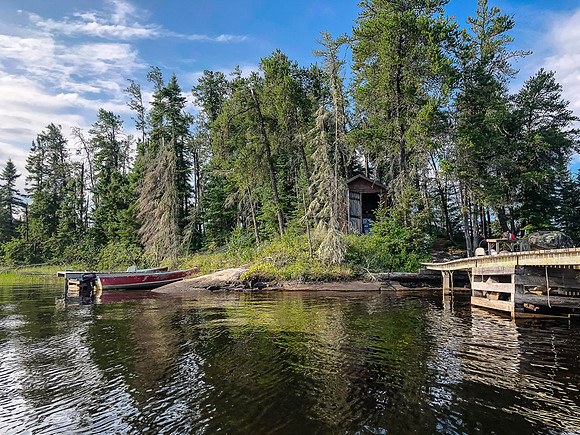 Rounding the far NE corner of Optic on our way up the Rostoul River towards Telescope Lake. This is an outpost of the Viking Island lodge.