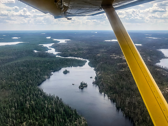 We'll be canoeing down this narrow waterway within a few hours. Haven at left and Adventure at right. As you can see, this area is already burned from previous fires.