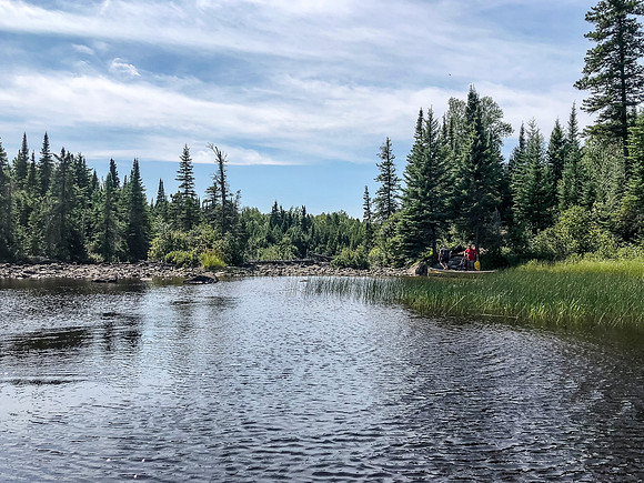 Looking back at H and H finishing up a portage along the Rostoul River.