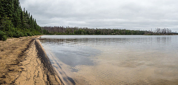 A beautiful sandy beach marks the portage from Wrist Lake into Streak Lake.