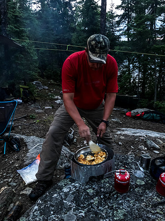 Harold cooks the fish.