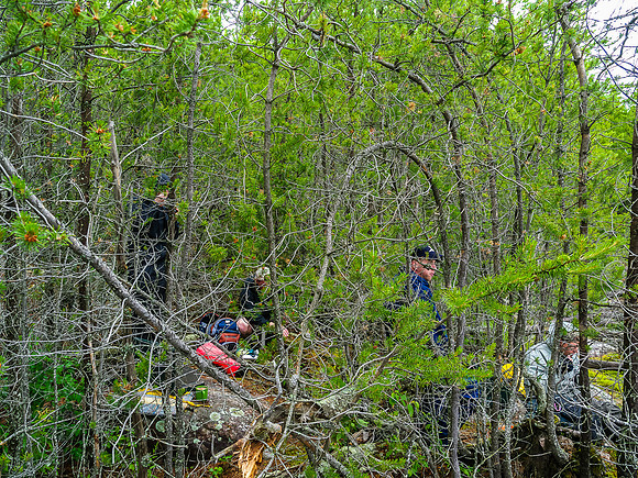 Eating lunch on Talon Lake. We're in the trees to avoid the driving wind / rain.