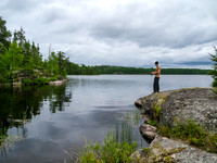 Josh tries for fish near camp. I think he got a small pike here. NOTE: No rain jacket!