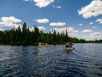The paddles dip into Leano Lake.