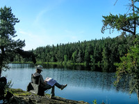 Ron relaxes with a magazine at our Haggart Lake camp.