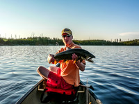 Eric with a large Lake Trout caught in Mather Lake.