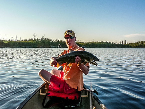 Eric with a large Lake Trout caught in Mather Lake.