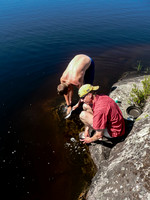 Eric and Vern wash their dishes at camp on Haggart Lake. Much later this evening, Eric will fall into the lake in this exact spot after brushing his teeth in the dark! :)