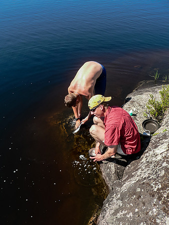 Eric and Vern wash their dishes at camp on Haggart Lake. Much later this evening, Eric will fall into the lake in this exact spot after brushing his teeth in the dark! :)