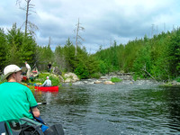Note the t-shirts and clearing skies!! YES! Coming up to another portage on the Garner River.