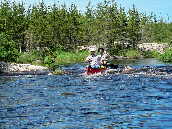 Ron and Dad run a small rapid along the Garner River.
