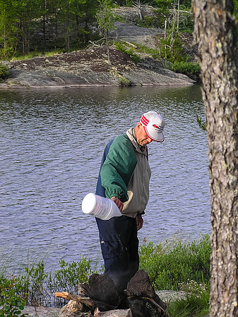 Dad douses what would be the last morning fire of his canoeing career.