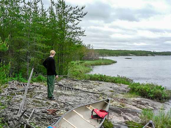 Eric surveys a small lake along the Garner River from another portage.