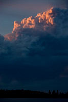 The smoke looks volcanic with the setting sun.