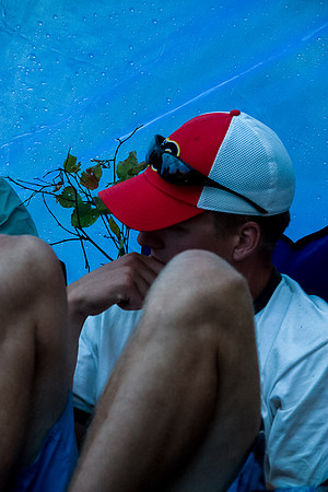 Huddled under a tarp.