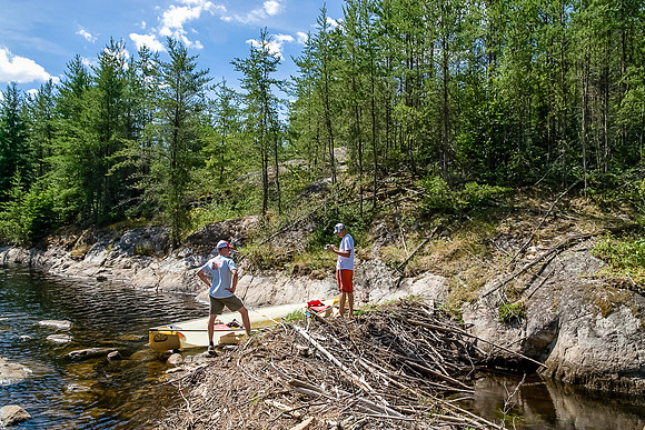 Trying to navigate down a small creek that's been dammed off by beavers. Jon maintained flip-flops on this one but his toes suffered!