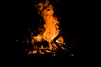 Monday comes to a close around a very cheerful bonfire.
