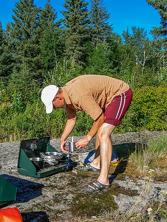 Vern making supper on Chase Lake.