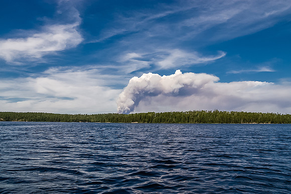 We paddle away from the fire.