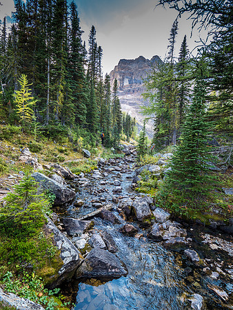 Standing on top of the waterfall from the Scarab Lake outlet stream into Egypt Lake below.