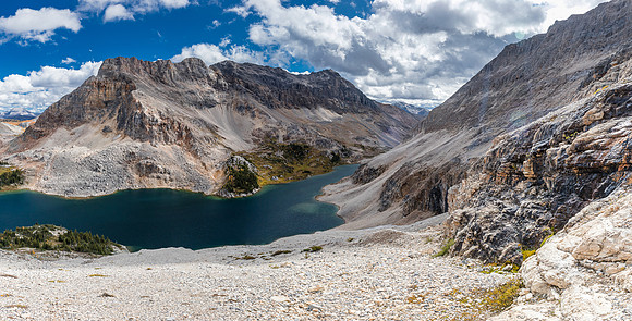 Looking along the lower cliffs with the scree bench traverse at upper right.