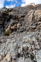 The moderate scramble to break the lower cliff to the scree ledge traverse.