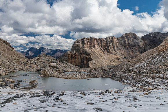Descending the lower glacier bowl to the frozen tarn.