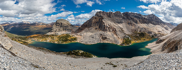 Traversing to break the lower cliff band with views of Mummy Lake and The Sphinx.