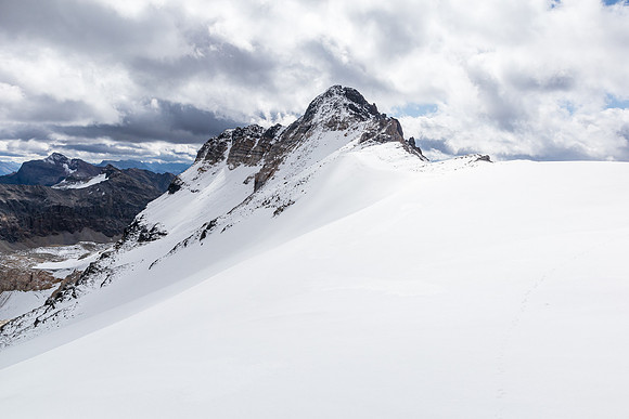 Ascending snow / glacier to the col, looking south to a nice outlier.