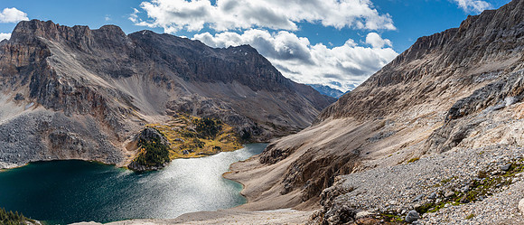 Views south over Mummy Lake - the scree bench between cliffs visible at right.