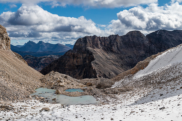 Views back over the glacial tarns to the unnamed peak east of Mummy Lake.