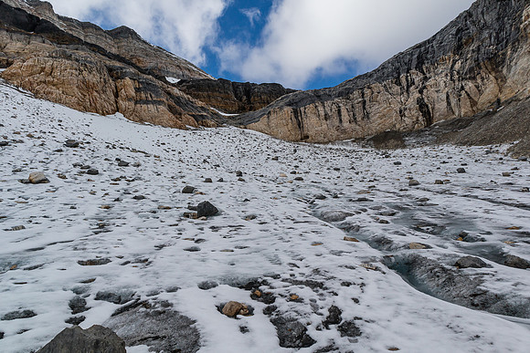 Descending the lower glacier bowl, looking back to the route breaking the cliffs.