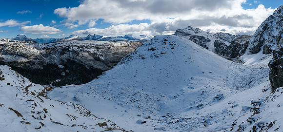 Views back over the lower route which comes up from the left under the cliffs than up at right.