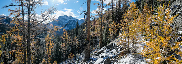 Crossing an open slope on route to Talc Lake with The Monarch visible at center left.