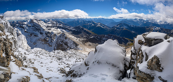 Descending back down the summit ridge on fresh snow.