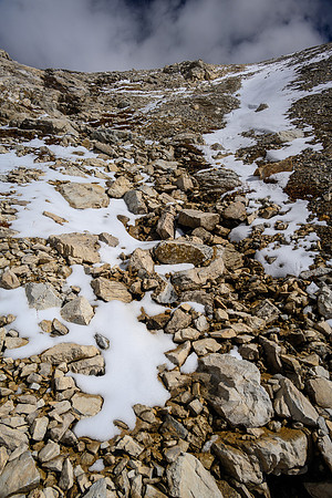 Ascending SW rubble slopes to the summit.