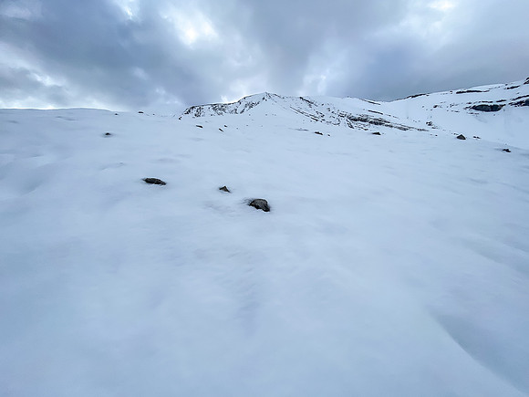 Looking up the very foreshortened and very snowy (!!) west ridge to the summit.
