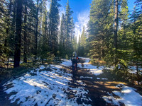 Biking in fresh snow on the South Ram River Trail.