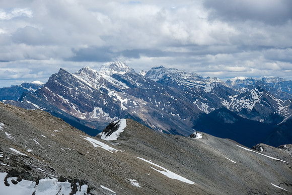 Mount Assiniboine looms in the clouds over Indian Peak.