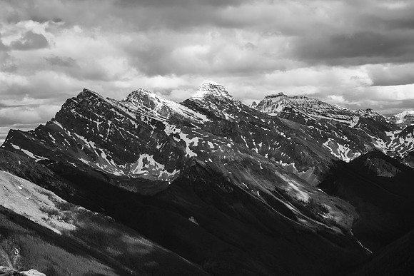 Mount Assiniboine looms in the clouds over Indian Peak.