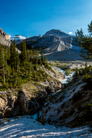 Now on the regular hiking trail, the lower moraine at center and cliff band to its left.