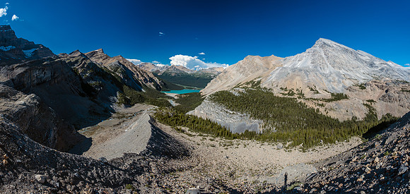 The trail runs to skier's right of the moraine crest