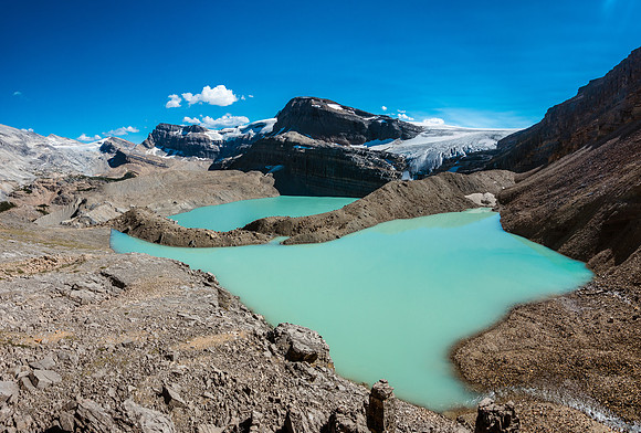 Traversing over the unnamed tarn on my way down to Iceberg Lake in the background
