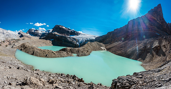 Traversing over the unnamed tarn on my way down to Iceberg Lake in the background