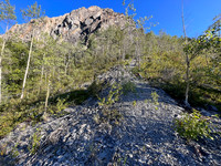 Traversing south slopes to the SE ascent gully.