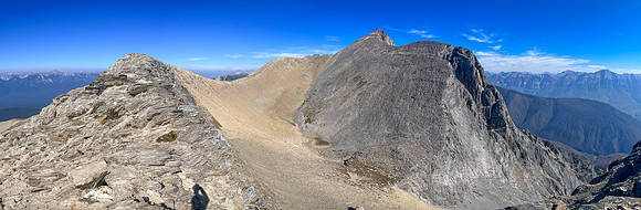 Views to the summit and SW face from the top of the SE ridge.