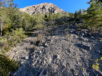 Traversing south slopes to the SE ascent gully.